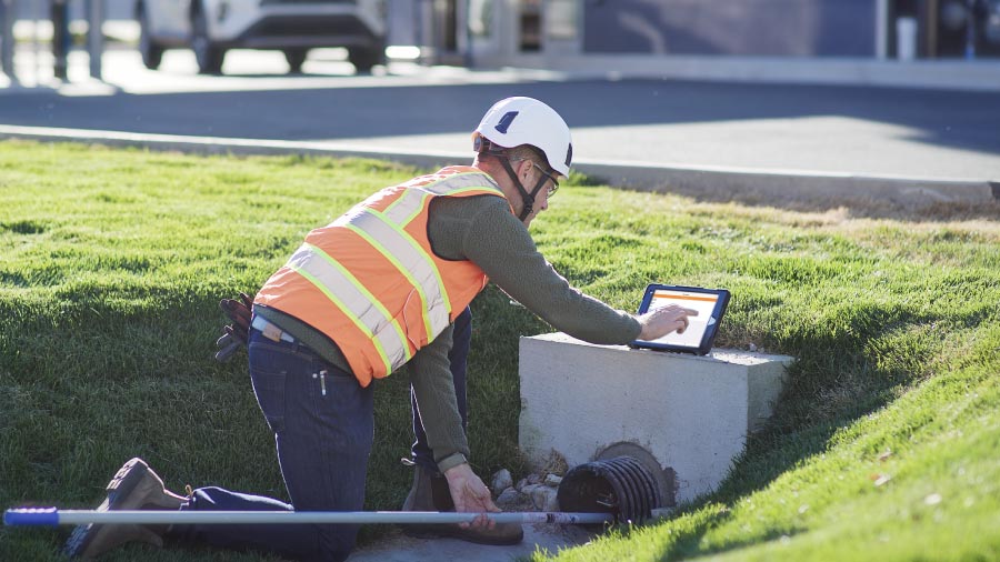 Utility Worker Using Pole And Camera To Visualization Storm Drain Fixing The Gap Between Your Water Audit And Field Data (2)